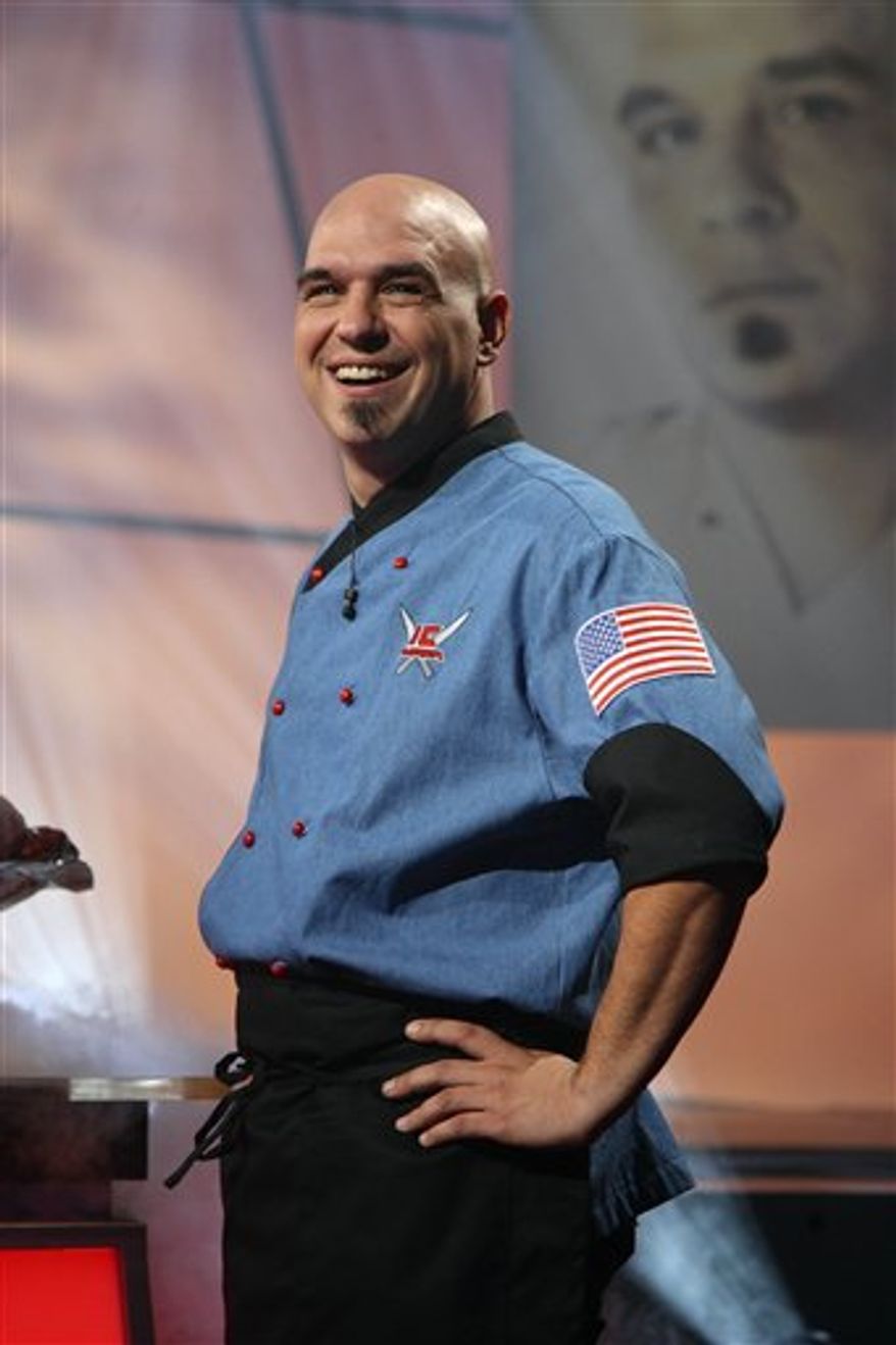 FILE- This file image released by Food Network shows chef Michael Symon. Symon won for top burger at the South Beach Wine and Food Festival Burger Bash Thursday, Feb. 24, 2011, in Miami Beach, Fla. (AP Photo/Food Network, FILE) NO SALES