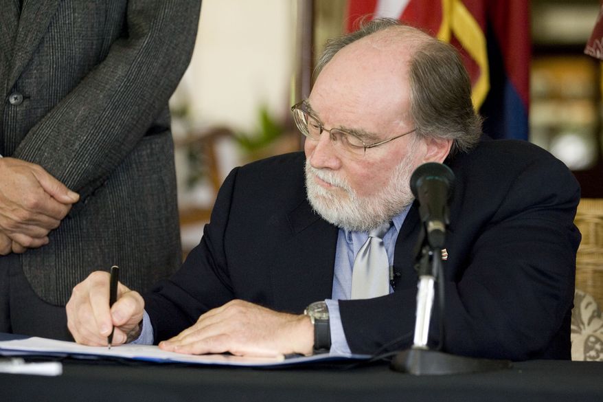 Hawaii Gov. Neil Abercrombie signs the Hawaii Civil Unions Bill into law at a ceremony in Honolulu on Wednesday, Feb. 23, 2011. The new law makes Hawaii the seventh state to give essentially the same rights of marriage to same-sex couples through civil unions or similar laws. Five other states and the District of Columbia allow same-sex marriage. (AP Photo/Eugene Tanner)
