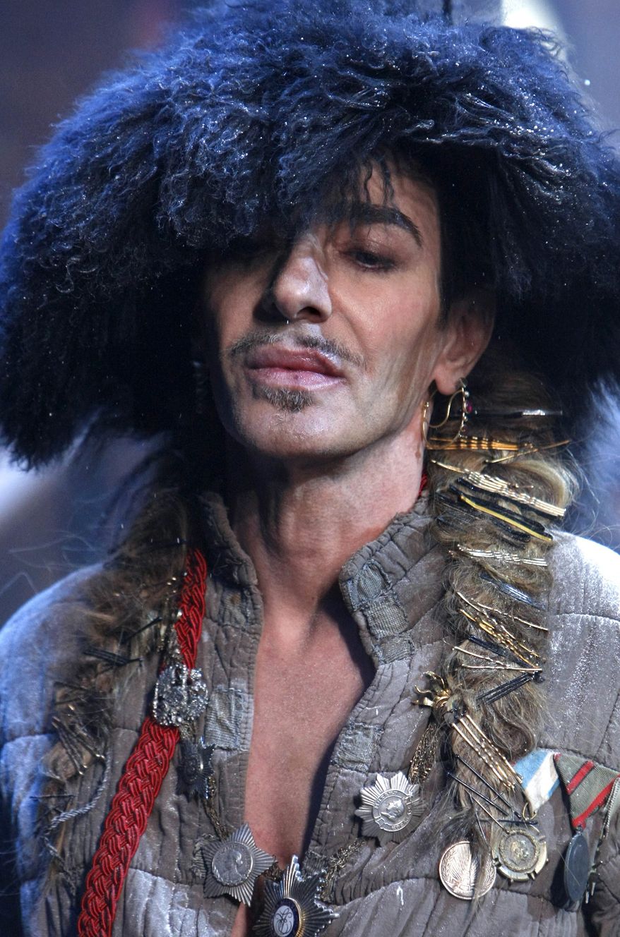 ** FILE ** In this Jan. 21, 2011, file photo, British fashion designer John Galliano appears at the end of his men's fall-winter 2011/2012 fashion collection presented in Paris. (AP Photo/Jacques Brinon, File)