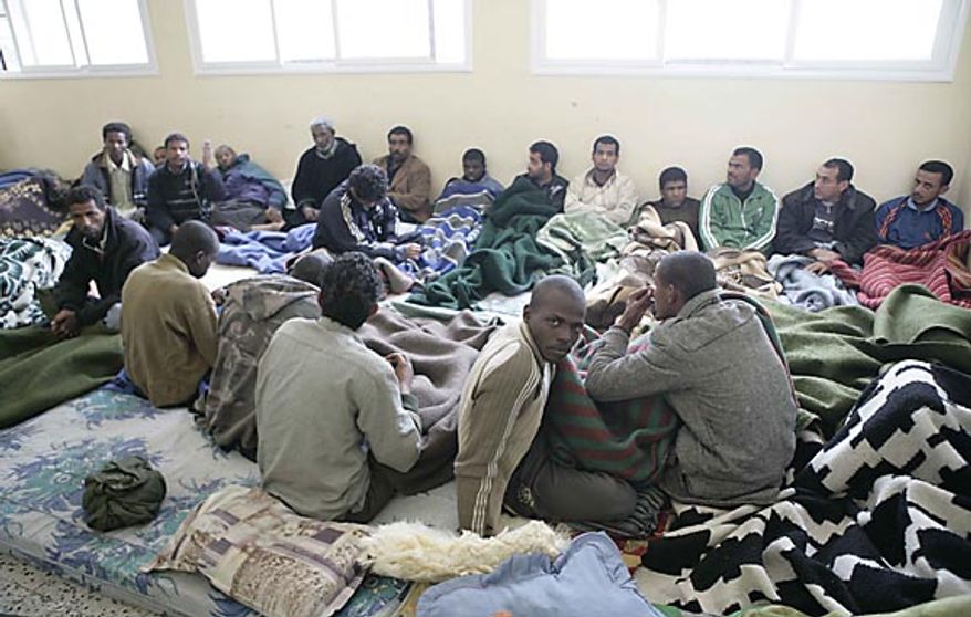 In this photo released by China's Xinhua News Agency, suspected mercenaries sit in a room in a school as they are held by anti-government protesters in the east Libyan city of Albayda, Thursday, Feb. 24, 2011. (AP Photo/Xinhua, Nasser Nouri)