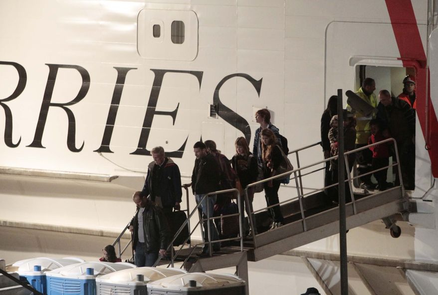 Passengers disembark from a ferry carrying Americans and other foreigners which arrived at the harbor in Valletta, Malta, Friday, Feb. 25, 2011. The Maria Dolores ferry left Tripoli's As-shahab port on an eight-hour trip to Valetta. Its passengers, at least 167 U.S. citizens and 118 other foreigners, have been aboard the catamaran since Wednesday in their quest to escape Libya's escalating turmoil, but rough seas prevented the ferry from leaving. (AP Photo/Gregorio Borgia)