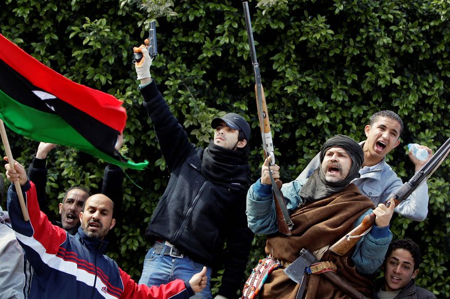 ARMED AND DANGEROUS: Anti-government forces show off their weapons in the main square in Az Zawiya, west of Tripoli, on Sunday. Hundreds prepare to repel an offensive by troops loyal to Moammar Gadhafi. (Associated Press)