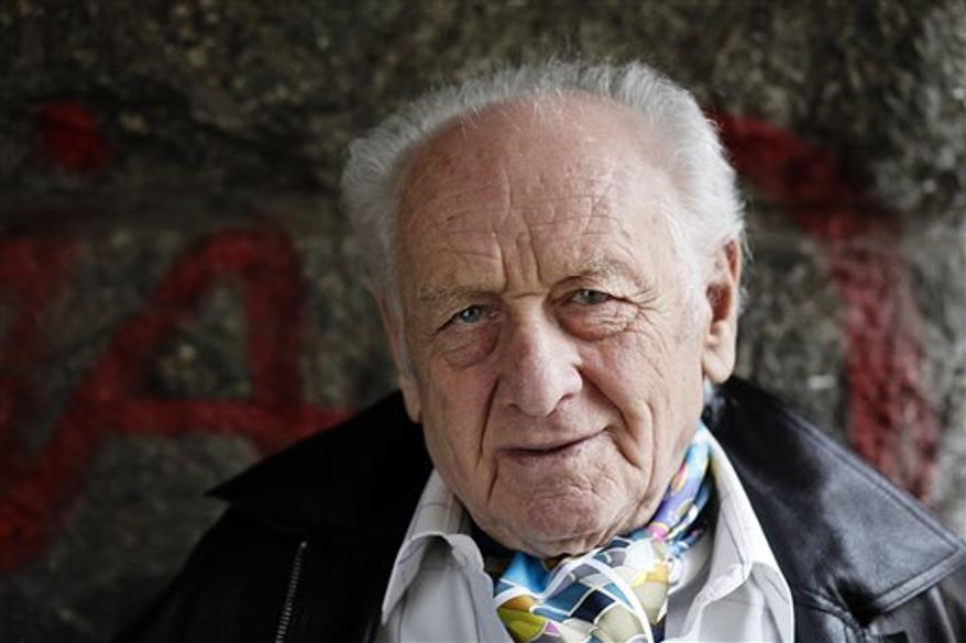 FILE - In this April 17, 2009 file photo, Czech author Arnost Lustig, who escaped from a Nazi death transport to make the Holocaust the main theme of his fiction, poses for a photograph in Prague. Jana Jelinkova, spokeswoman for Prague's Kralovske Vinohrady university clinic says Lustig died early Saturday, Feb. 26, 2011. He was 84. (AP Photo/CTK, Martin Sterba) SLOVAKIA OUT