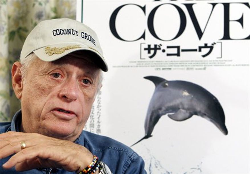 FILE - In this Oct. 21, 2009, file photo Louie Psihoyos, American director of an award-winning documentary, "The Cove," speaks following the screening of his film as its Japan premiere at the Tokyo International Film Festival in Tokyo, Japan. Copies of the Oscar-winning film that depicts the slaughter of dolphins in the Japanese fishing village of Taiji have been delivered free to all its residents, compliments of the director. Psihoyos, director of "The Cove," said Monday Feb. 28, 2011, the film dubbed in Japanese was delivered via regular mail over the weekend, with the help of a local group called People Concerned for the Ocean. (AP Photo/Shuji Kajiyama, File)