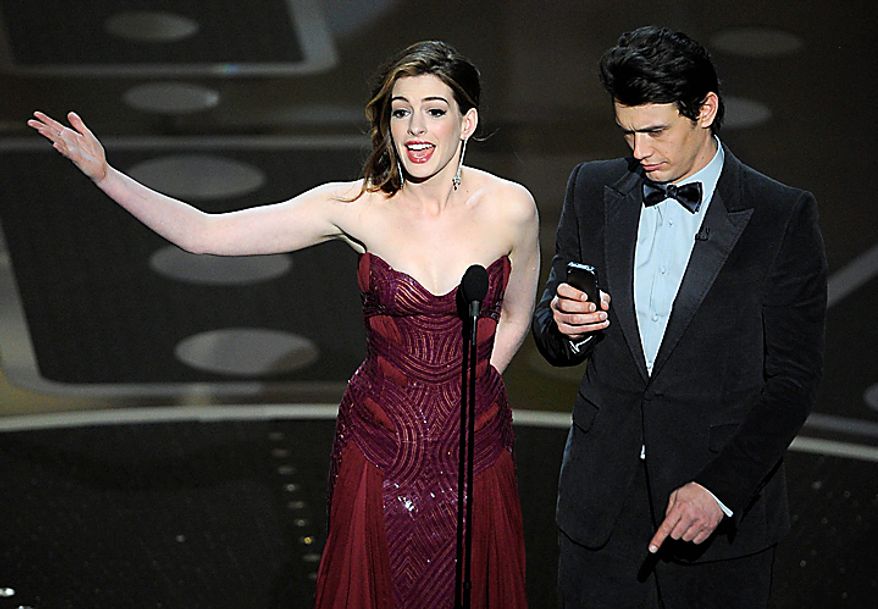 Show hosts Anne Hathaway, left, and James Franco are seen during the 83rd Academy Awards on Sunday, Feb. 27, 2011, in the Hollywood section of Los Angeles. (AP Photo/Mark J. Terrill)