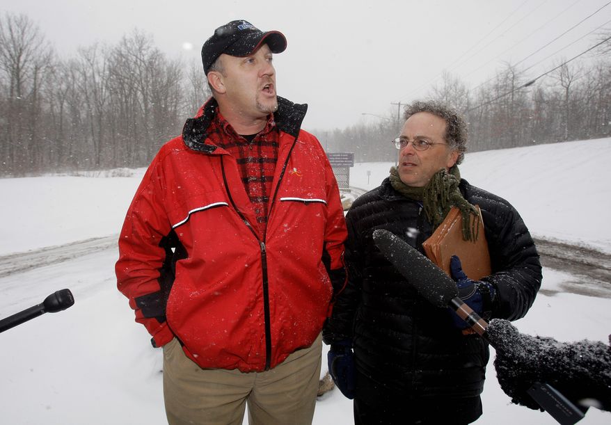 Banker Bradley Birkenfeld, a whistleblower implicated in a tax evasion case against Swiss bank UBS AG (left) and Stephen Kohn, executive director of the National Whistleblowers Center, hold a press conference in January 2010 before Birkenfeld reports to a federal prison. (Associated Press)