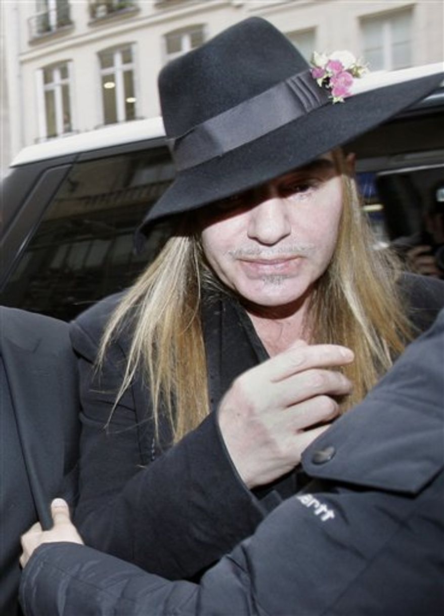 FILE - In this Monday, Feb. 28, 2011 file photo, Fashion designer John Galliano arrives at a police station in Paris. Christian Dior have fired Galliano in wake of alleged anti-Semitic remarks he made during a dispute at a trendy Paris cafe. (AP Photo/Michel Euler, File)
