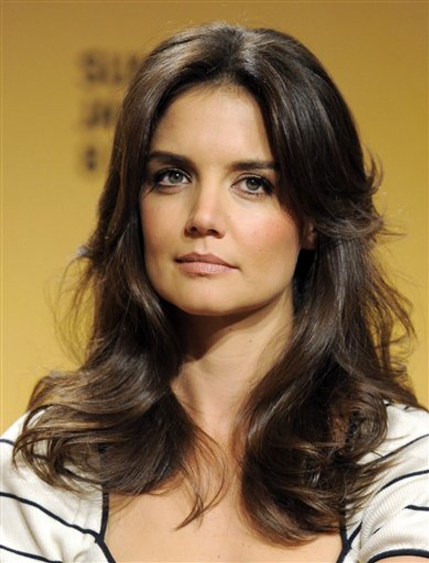 FILE - In this Jan. 16, 2011 file photo, actress Katie Holmes is pictured before announcing nominations for the 68th Annual Golden Globe Awards in Beverly Hills, Calif. (AP Photo/Chris Pizzello, file)
