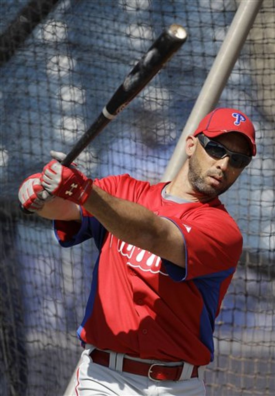 Philadelphia Phillies left fielder Raul Ibanez waits to hit in the batting cage before a baseball spring training game against the New York Yankees Saturday, Feb. 26, 2011, at Steinbrenner Field in Tampa, Fla. (AP Photo/Charlie Neibergall)