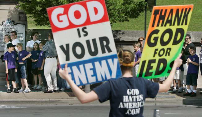 ** FILE ** Rebekah Phelps-Roper, demonstrating near the Tennessee Capitol in 2006, is a member of Westboro Baptist Church, a group whose right to protest at funerals of American soldiers killed in combat carrying signs such as &quot;Thank God for Dead Soldiers&quot; and &quot;Priests Rape Boys&#x27;&#x27; was upheld by the Supreme Court in 2011. (Associated Press)