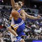 Golden State Warriors&#39; Stephen Curry (30) drives to the basket against Washington Wizards&#39; Yi Jianlian, of China, during the second half of an NBA basketball game in Washington, Wednesday, March 2, 2011. Warriors won 106-102. Curry scored 29 points. (AP Photo/Manuel Balce Ceneta)