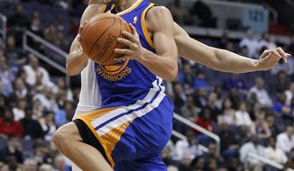 Golden State Warriors&#39; Stephen Curry (30) drives to the basket against Washington Wizards&#39; Yi Jianlian, of China, during the second half of an NBA basketball game in Washington, Wednesday, March 2, 2011. Warriors won 106-102. Curry scored 29 points. (AP Photo/Manuel Balce Ceneta)