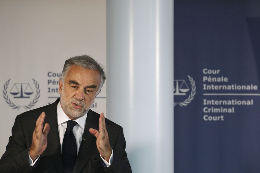 International Criminal Court Prosecutor Louis Moreno-Ocampo presents an overview of alleged crimes committed in Libya since Feb. 15 during a press conference at the ICC in The Hague on Thursday, March 3, 2011. Mr. Moreno-Ocampo said he will investigate Col. Moammar Gadhafi and his inner circle, including some of his sons, for possible crimes against humanity in the violent crackdown on anti-government protesters. (AP Photo/Peter Dejong)