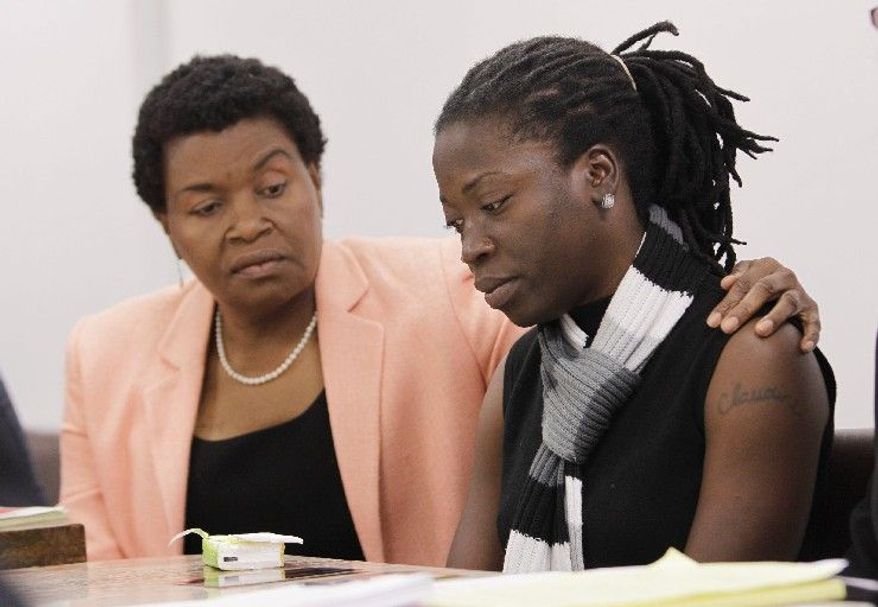 Marleine Bastien (left) tries to comfort Claudine Magloire, a U.S. permanent resident, as she talks about her fiance, Wildrick Guerrier, in Miami last month. He was a Haitian man who suffered choleralike symptoms and died in his Caribbean homeland after the U.S. government deported him. He had participated in a hunger strike while detained in the U.S. and wrote to immigration attorneys that returning to Haiti amounted to a death sentence. (Associated Press)