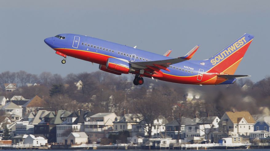 A Southwest Airlines Boeing 737 jetliner takes off from Logan International Airport in Boston on Thursday, Jan. 20, 2011. Southwest has joined other carriers in a sweeping increase of $10 in the price of many domestic round-trip airfares, citing the need to offset higher fuel prices. (AP Photo/Stephan Savoia)