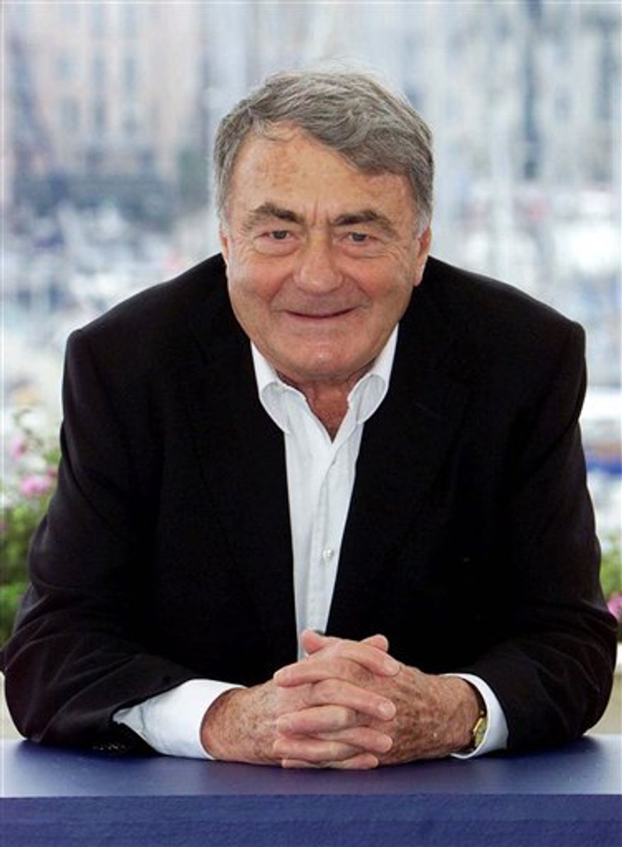 FILE - Monday, May 14, 2001 file photo of French director Claude Lanzmann during a photocall for his film "Sobibor," at the 54th International Film Festival in Cannes, southern France. An epic French documentary about the Holocaust, dubbed into Farsi, is to be broadcast on a satellite channel in Iran as part of a campaign to promote understanding between Jews and Muslims and to fight Holocaust denial. Filmmaker Claude Lanzmann's renowned 9-plus-hour film "Shoah" includes testimony from concentration camp survivors and employees about the slaughter of millions of Jews in Europe during World War II. (AP Photo/Lionel Cironneau, File)