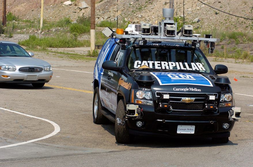 The GM-Carnegie Mellon Collaborative Research Labs' self-driving sport utility vehicle called Boss, a robotized Chevrolet Tahoe, goes through its paces loaded with equipment that allows it to operate without a driver. (Carnegie Mellon University)
