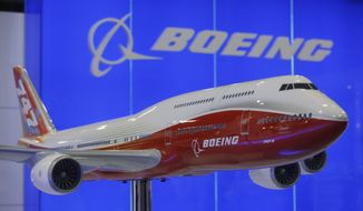 **FILE** A model of the Boeing 747-8 aircraft is on display at the Asian Aerospace Expo and Congress 2011 in Hong Kong on March 8, 2011. (Associated Press)