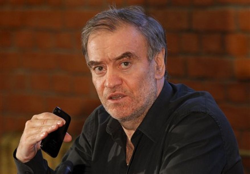 FILE - In this photo taken Sept. 15, 2010, conductor Valery Gergiev gestures at a news conference in the theater in St. Petersburg, Russia. Gergiev canceled his performance of "Boris Godunov" at the Metropolitan Opera on Wednesday, march 9, 2011, and was replaced by Pavel Smelkov. The Met said in a statement that Gergiev was "suffering from exhaustion and resting in St. Petersburg." (AP Photo/Dmitry Lovetsky, file)