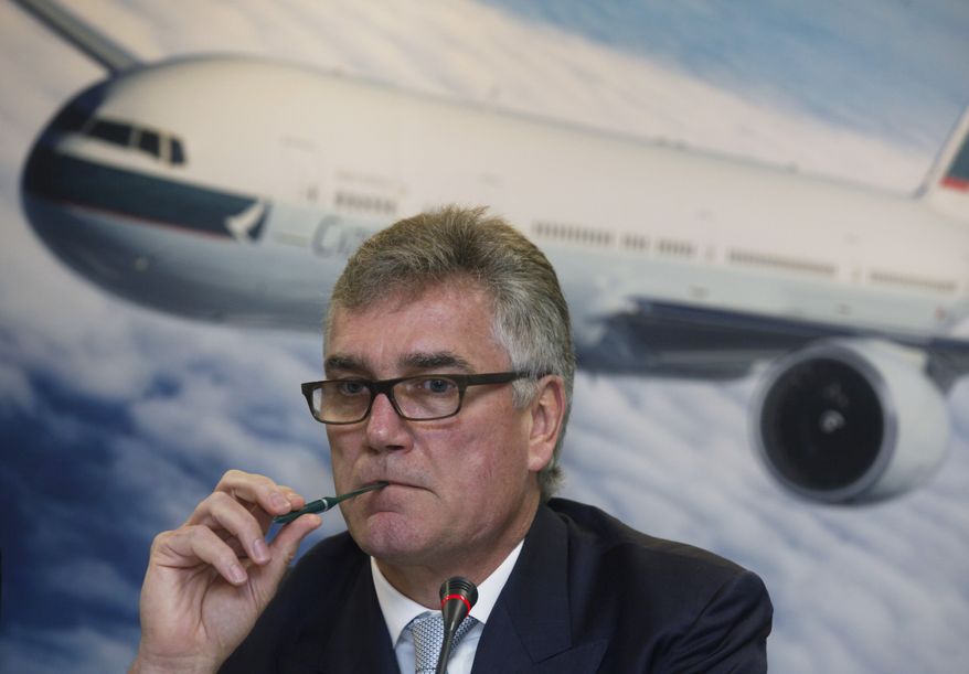 Christopher Pratt, chairman of Cathay Pacific Airways Limited, attends a company announcement in Hong Kong Wednesday, March 9, 2011. The airline company is ordering 27 new Airbus and Boeing jets to expand services, especially in Asia, and says profits tripled. (AP Photo/Kin Cheung)