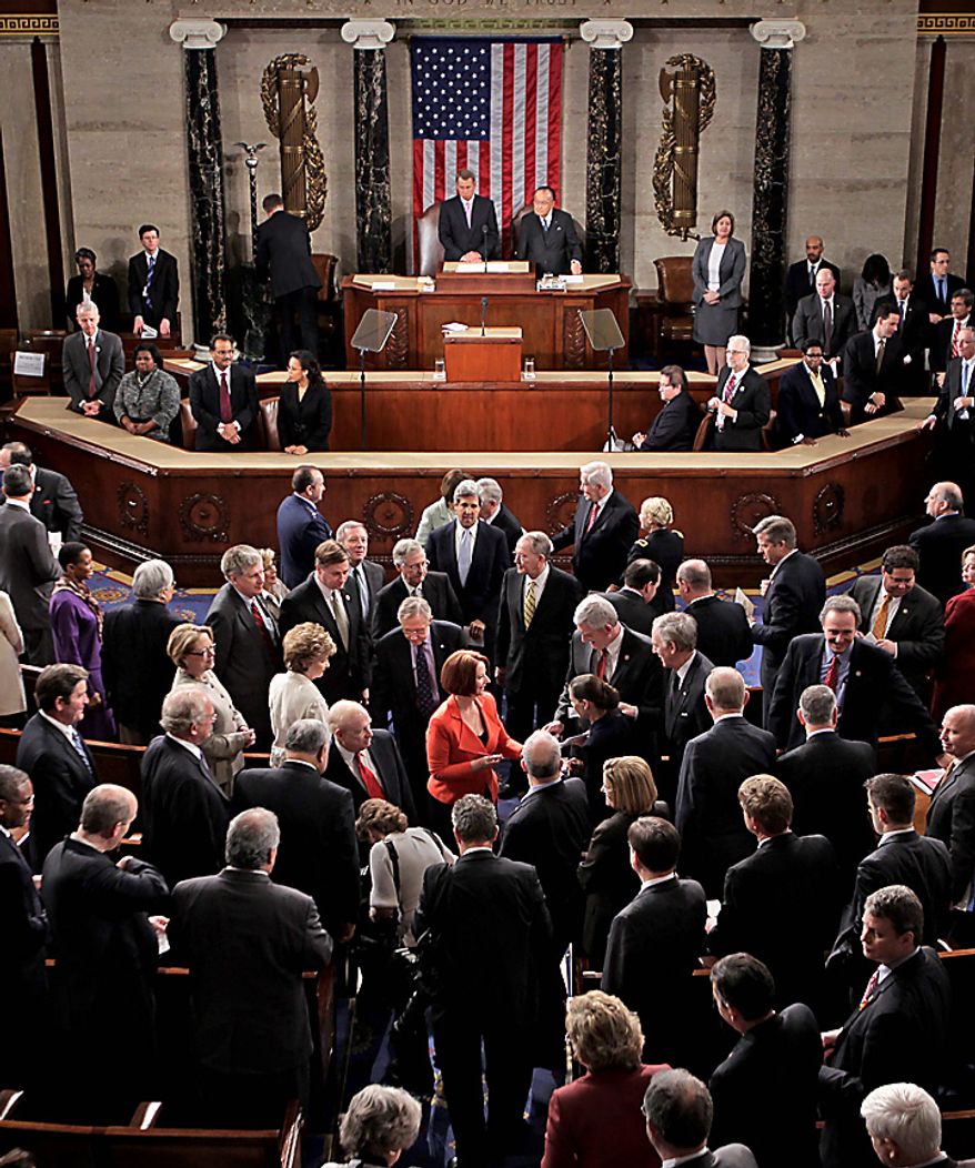 Australian Prime Minister Julia Gillard, at center in red, is surrounded after she addressed a joint meeting of the U.S. Congress in the House of Representatives at the Capitol in Washington, Wednesday, March 9, 2011.  (AP Photo/J. Scott Applewhite)