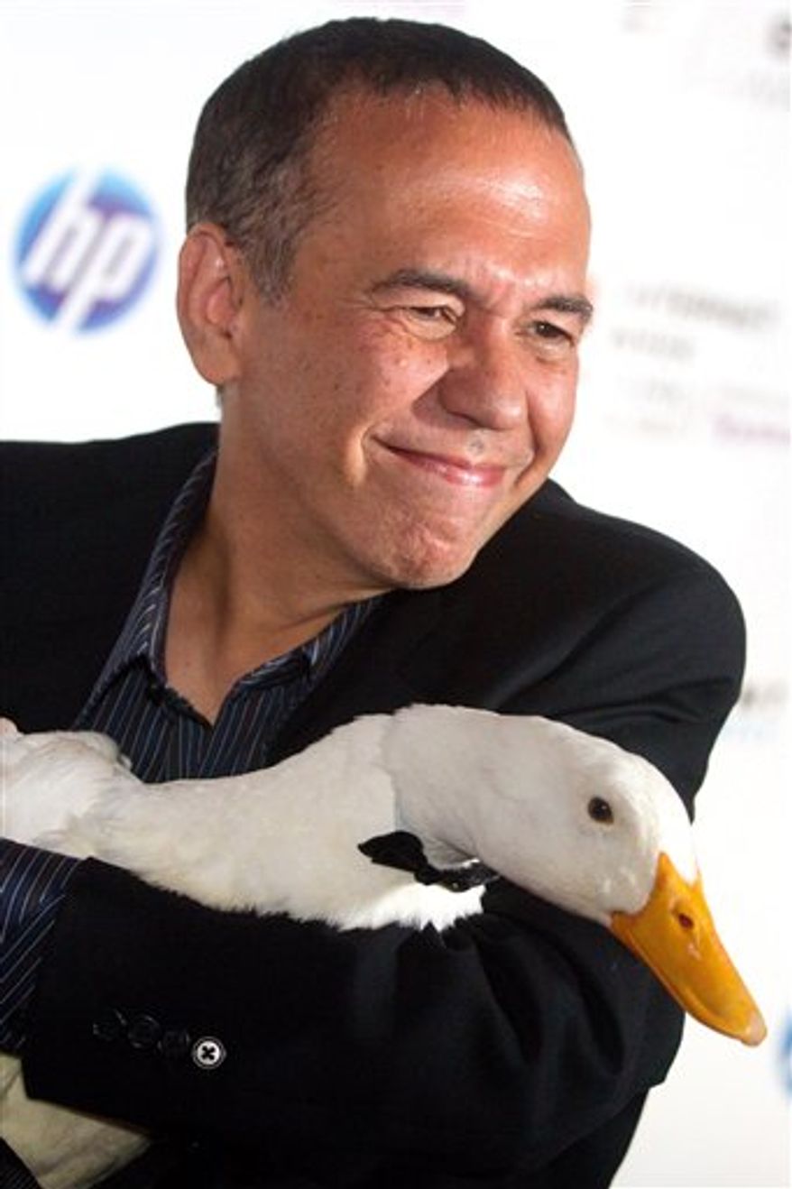 FILE - In this June 14, 2010 file photo, Gilbert Gottfried arrives with the Aflac duck to the 14th Annual Webby Awards in New York. Aflac on Monday, March 14, 2011 announced that it has severed ties with Gottfried over jokes about the earthquake and tsunami in Japan that the comedian posted on Twitter. (AP Photo/Charles Sykes, File)