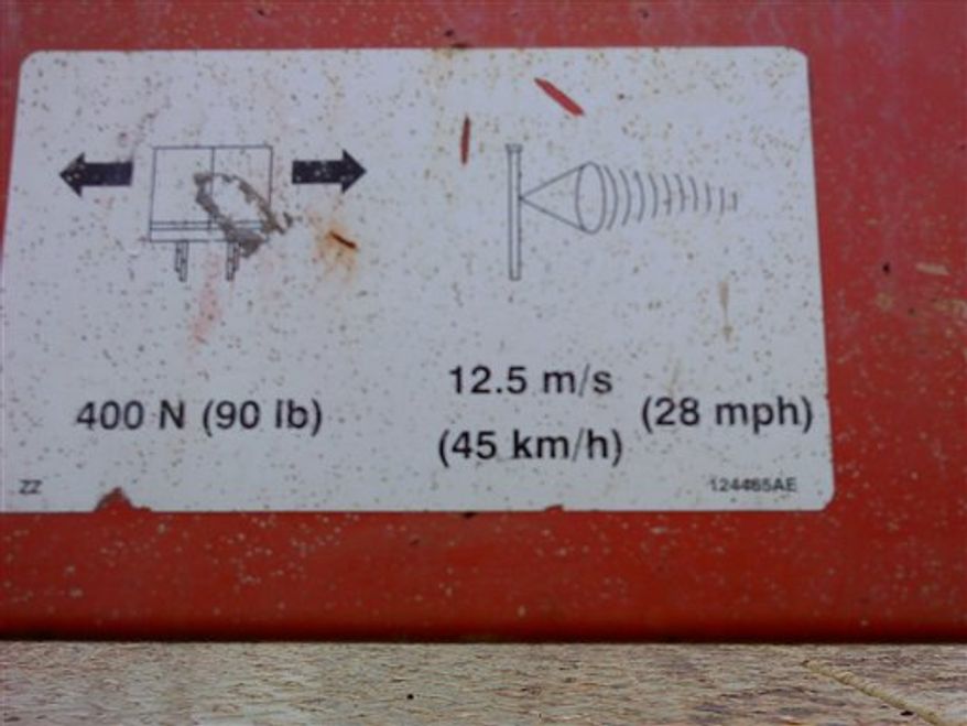 In this photo provided by the Indiana Department of Labor on March 15, 2011, shows a warning sign on a lift at the scene of an accident that killed Notre Dame student Declan Sullivan in South Bend, Ind., Oct. 27, 2010 while he filmed Notre Dame football practice. Indiana state regulators have found that the University of Notre Dame did not maintain safe working conditions when Sullivan, a 20-year-old junior film student, died as he filmed football practice from a hydraulic lift that toppled in extreme high winds. (AP Photo/Indiana Department of Labor)
