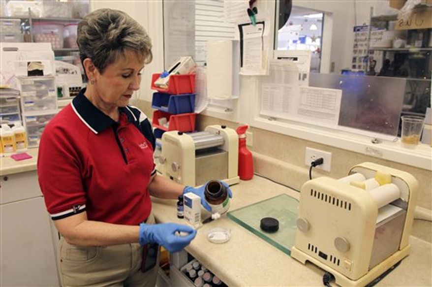 This Tuesday, March 15, 2011 photo shows a bottle of potassium iodide at the Texas Star Pharmacy on Tuesday, March 15, 2011 in Plano, Texas. The pharmacy has been receiving an unusually high number of calls about potassium iodide from people who are afraid radiation from the Japan nuclear crisis will reach the U.S. Health agencies in California and western Canada warned Tuesday that there's no reason for people an ocean away to suddenly stock up on potassium iodide, even as some key suppliers say they're back-ordered and getting panicked calls from would-be customers. (AP Photo/Richard Matthews)