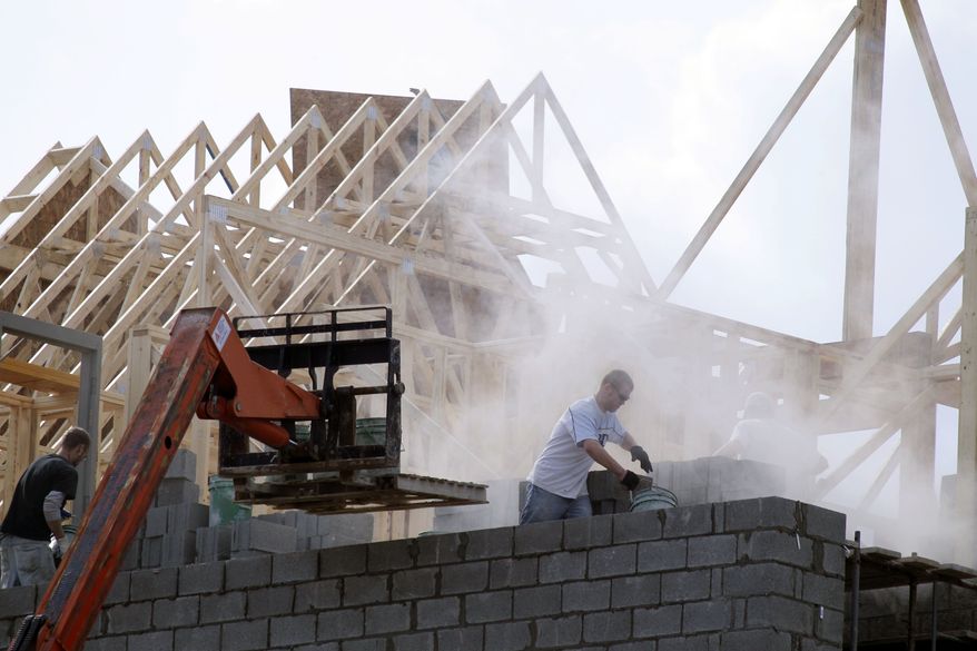 In this photo made on Feb. 17, 2011, construction continues on a row of condominiums in Cranberry, Pa., Butler County. Builders likely broke ground on fewer homes in February, a reflection of declines in home prices and diminished demand that has made it difficult for them to compete. (AP Photo/Keith Srakocic)