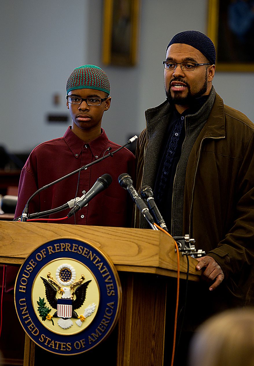 Isma'il Clayton, 13, and his father Kyle talk about Isma'il's experiences being bullied by his classmates because of his Asperger's Syndrome during a Congressional briefing on Bullying of Children with Special Needs Wednesday, March 16, 2011. Mr. Clayton is demanding a zero-tolerance policy on bullying in schools. (Barbara L. Salisbury/The Washington Times)