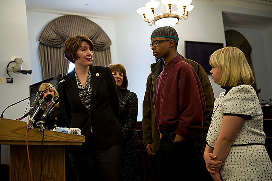 Congresswoman Cathy Morris Rodger (R-Wash.), left, thanks Isma'il Clayton, 13, who has Asperger's Syndrome, and Lauren Potter, an actress on the show Glee, who has Down Syndrome, for sharing their experiences and stories about being teased about being different during a Congressional briefing on the Bullying of Children with Special Needs on Wednesday, March 16, 2011. The congresswoman herself is the parent of a special needs child. (Barbara L. Salisbury/The Washington Times)