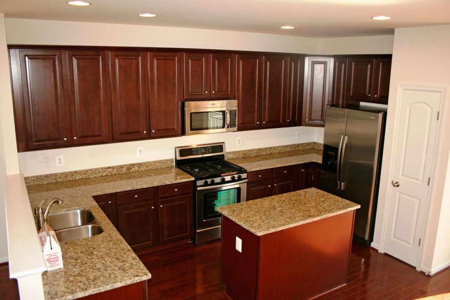 The Chandler model at Brighton Place has 42-inch oak cabinets and a pantry in the center-island kitchen, which is open to the breakfast area. It is priced from the mid-$200,000s.