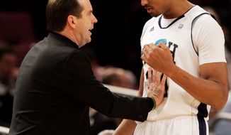 Mike Brey instructs Carleton Scott during action against the University of Cincinnati in a Big East tournament game March 10 in New York City. &quot;The kids I&#39;ve got are a lot of gym rats. ... I think it´s kind of refreshing,&quot; he says. (Associated Press)
