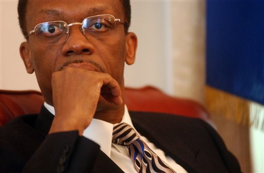 FILE - In this Jan. 30, 2004 file photo, Haiti's President Jean-Bertrand Aristide listens to a journalist's question during a press conference in Port-au-Prince, Haiti. Rumors of Aristide's return have circulated in Haiti for weeks. Aristide built a following among the country's poverty-stricken population as a priest-turned-activist, among the leaders of the 1986 movement to oust the despotic Jean-Claude "Baby Doc" Duvalier. He became Haiti's first democratically elected leader in 1990 but was toppled a few months later by a military junta. He was ousted a second time, in the 2004 rebellion and flown into exile in South Africa. (AP Photo/Rodrigo Abd, File)
