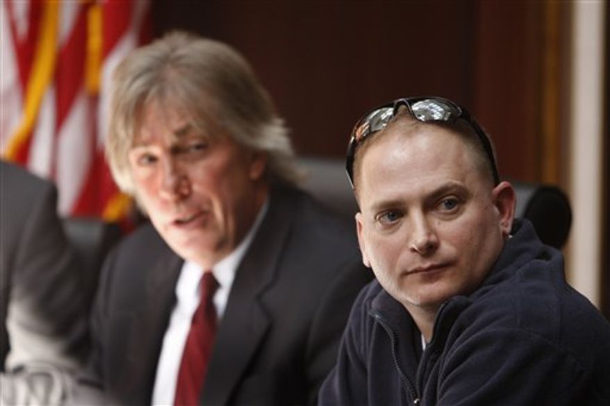 FILE - In this March 3, 2010 file photo, attorney Geoffrey Fieger, left, and Master Sgt. Jeffrey Sarver are seen during a news conference in Southfield, Mich. Sarver, a bomb disposal expert who served in the Iraq war filed a lawsuit against the makers of the film "The Hurt Locker." (AP Photo/Carlos Osorio, file)