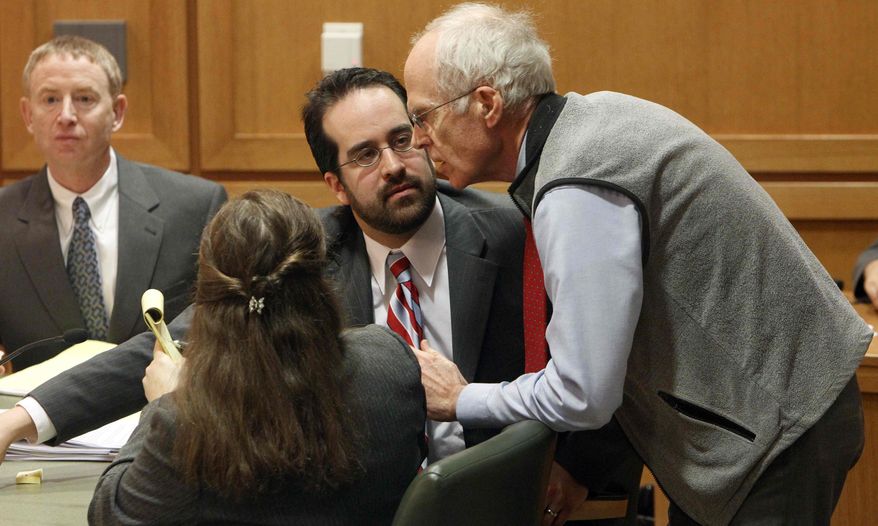 Wisconson Secretary of State Douglas La Follette, right, confers with assistant attorneys general Maria Lazar, foreground, and Steven Kilpatrick, center, after a judge issued a temporary restraining order Friday, March 18, 2011, barring the publication of a controversial new law that would sharply curtail collective bargaining for public employees during a hearing in Dane County Court in Madison, Wis. (AP Photo/Pool, Mark Hoffman)