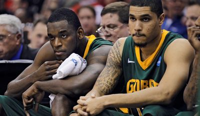 George Mason&#39;s Mike Morrison (left) and Isaiah Tate watch the final moments of the team&#39;s 98-66 loss to Ohio State on Sunday. Although Tate is a senior, Morrison and Ryan Pearson will return in the Patriots&#39; frontcourt next season. (Associated Press)