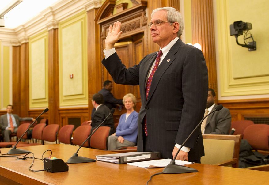 Interim Attorney General Irvin B. Nathan is sworn in prior to his testimony before members of the D.C. Council committee considering his confirmation at a hearing at the Wilson Building in the District on Wednesday. (Rod Lamkey Jr./The Washington Times)