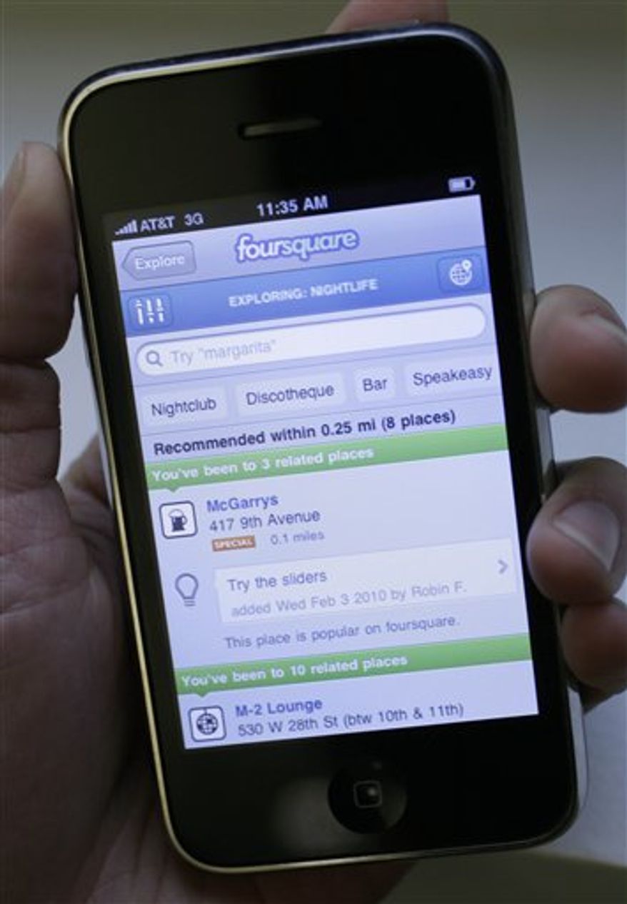 Foursquare is displayed on an Apple iPhone 3GS, Wednesday, March 23, 2011 in New York. (AP Photo/Mark Lennihan)