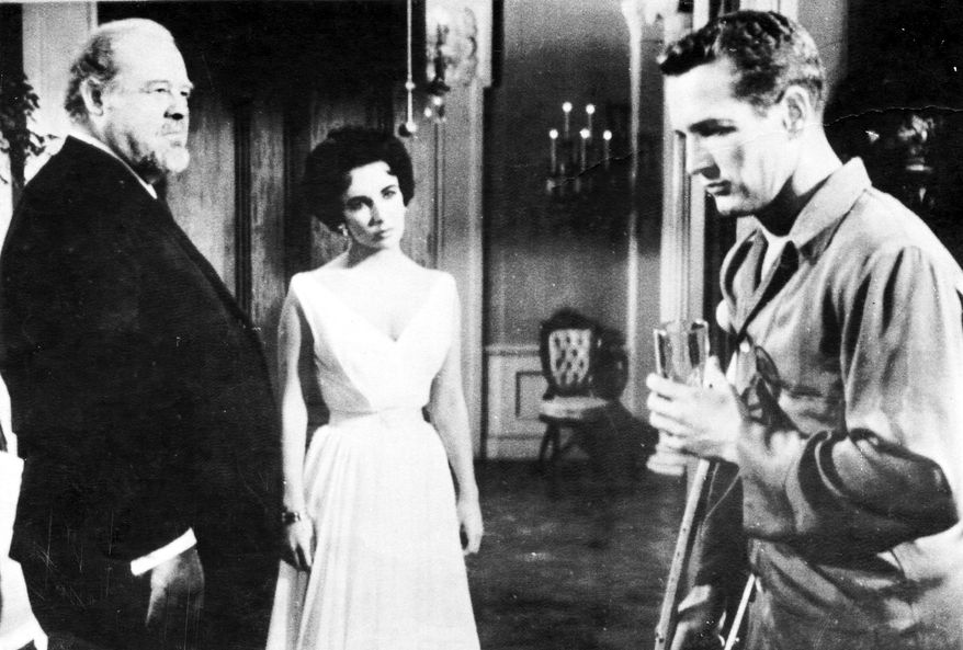 Elizabeth Taylor starred with Burl Ives (left) and Paul Newman in the 1958 film adaptation of Tennessee Williams' "Cat on a Hot Tin Roof."