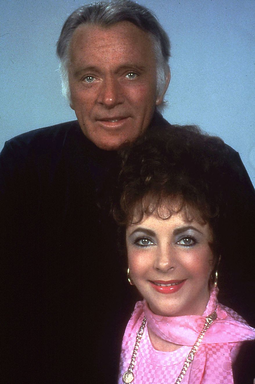 This 1983 file photo shows actress Elizabeth Taylor and actor Richard Burton, one of Taylor's former husbands, posing during a rehearsal for the Broadway revival in New York of Noel Coward's "Private Lives." Publicist Sally Morrison says Taylor died Wednesday, March 23, 2011 in Los Angeles of congestive heart failure at age 79. (AP Photo/File)