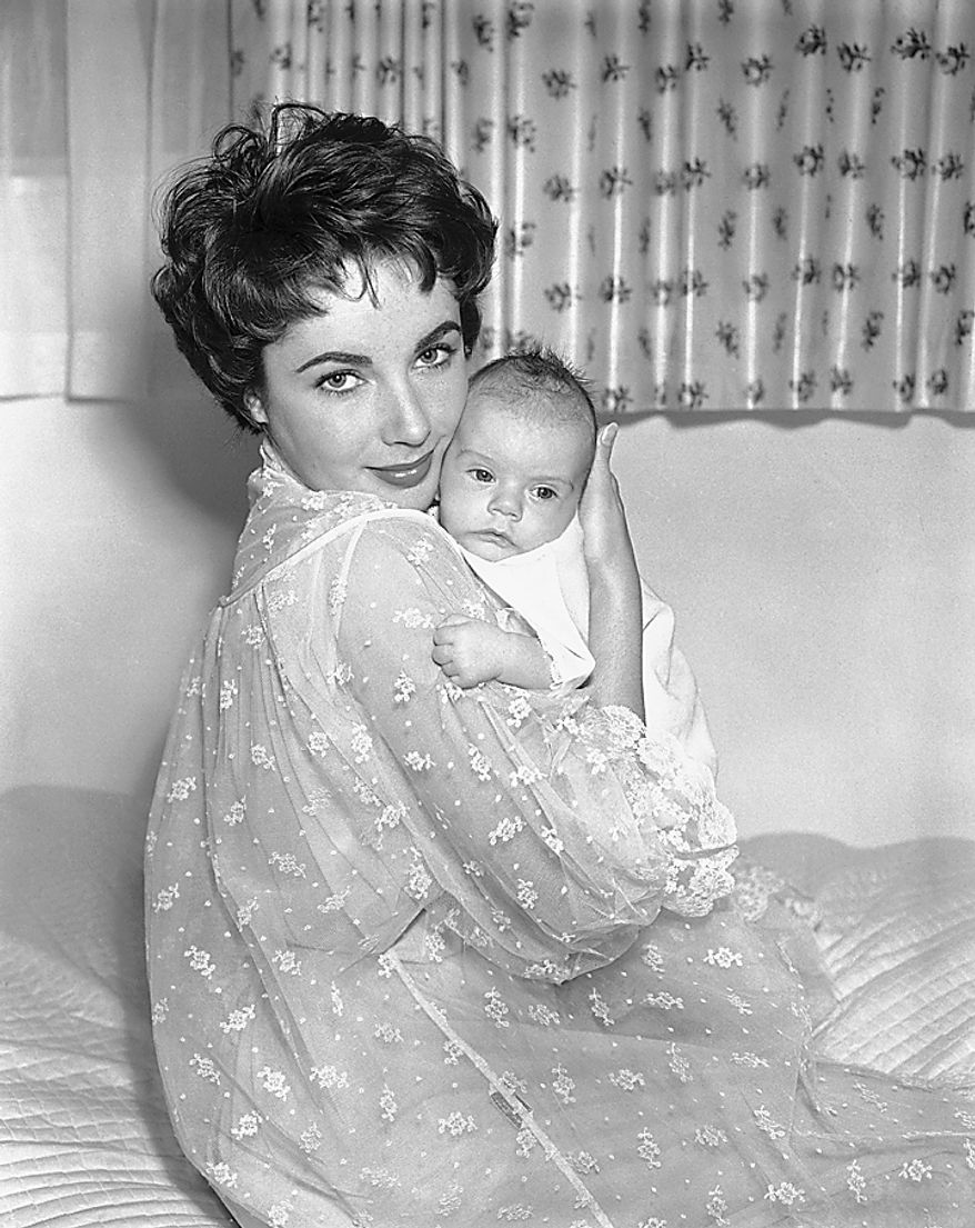 A Jan. 6, 1953 file photo shows one of the first pictures of Elizabeth Taylor with son Michael Howard Wilding, son of Taylor and English actor Michael Wilding. Publicist Sally Morrison says the actress died Wednesday, March 23, 2011 in Los Angeles of congestive heart failure at age 79. (AP Photo, File)