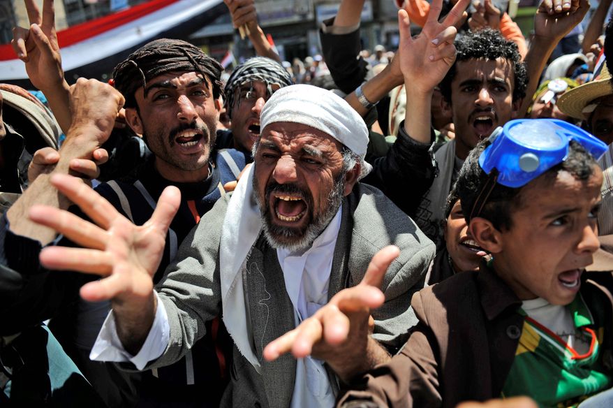 An anti-government protester makes his feelings known Thursday in Sanaa. The leader of Yemen's largest tribe has announced his support for opposition demands that the country's longtime president step down. (Associated Press)