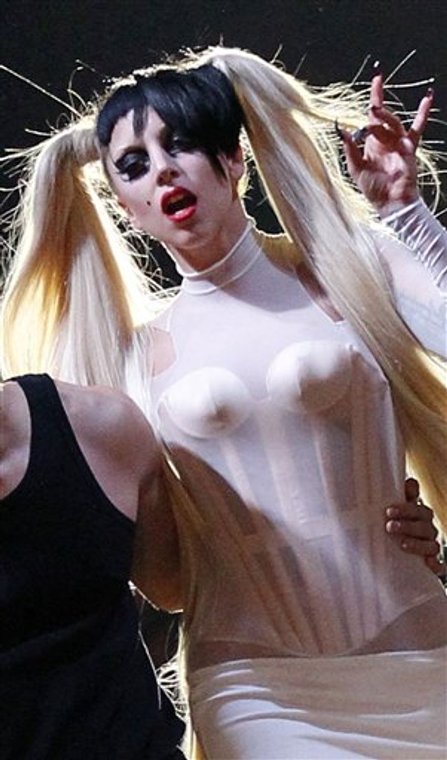 FILE - In this file photo taken Wednesday, March 2, 2011, Lady Gaga appears at the end of Thierry Mugler Fall-Winter ready-to-wear 2012 fashion collection presented in Paris. Lady Gaga has urged young Malaysians to protest the censorship of lyrics in her hit song that encourage acceptance of gays. (AP Photo/Francois Mori, File)