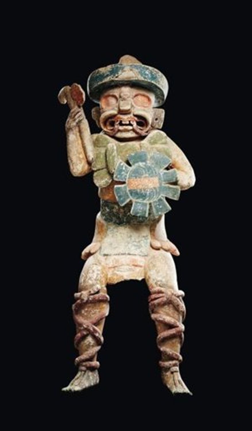 In this photo provided by Paris-based Binoche Et Giquello auction house gallery on Wednesday March 23, 2011 is seen a Mayan-style statue. The Mexican government on Wednesday said a Mayan-style statue that brought a record $4 million (2.9 million euros) at auction this week is a fake. Auctioneers vow it is genuine and claim Mexico wants to quash legal sales of pre-Hispanic artifacts. (AP Photo/Binoche Et Giquello) NO SALES