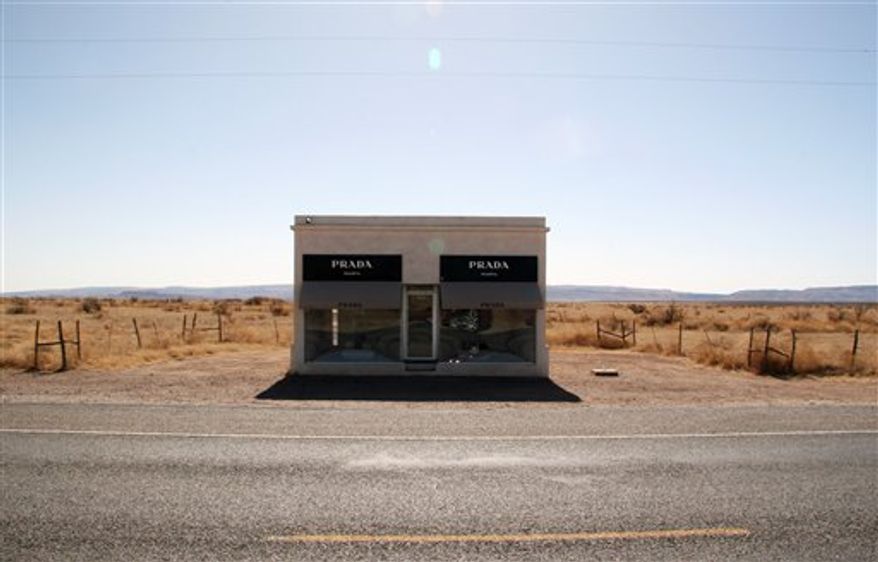 This March 9, 2011 photo shows the Prada Marfa art project located about 35 miles west of Marfa, Texas. The iconic sculpture intended to mimic a store of the Italian fashion house has come under repeated attack by vandals since it was finished in 2005. (AP Photo/Mike Graczyk)
