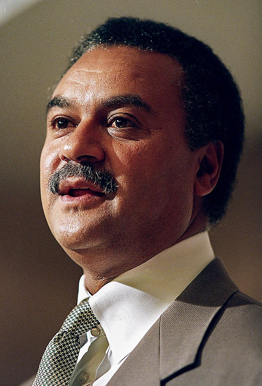 ** FILE ** Commerce Secretary Ron Brown is shown in this May 1995 file photo. The special prosecutor investigating Brown is reviewing activities with an Oklahoma gas company that include a $160,000 payment to Brown's son and trips for a top Commerce aide, according to interviews and documents. (AP Photo/File, J. Scott Applewhite)