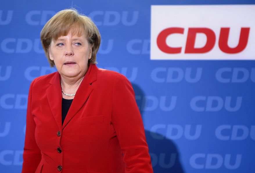 German Chancellor Angela Merkel, who also is chairwoman of the conservative Christian Democratic Union party,
arrives for the party's weekly executive committee meeting in Berlin on Monday, March 28, 2011. The CDU suffered a major defeat Sunday in Baden-Wuerttemberg state elections after almost six decades in power there. (AP Photo/dapd/Berthold Stadler)