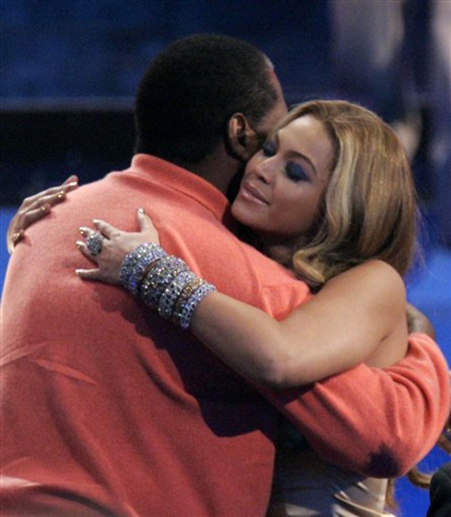 FILE - In this Nov. 18, 2007 file photo, singer Beyonce Knowles hugs her father Mathew Knowles after being named the recipient of the International Star of the Year Award at the American Music Awards in Los Angeles. In a statement released by her publicist on Monday, March 28, 2011, Beyonce announced that she and her father have parted ways "on a business level." Mathew Knowles has managed his daughter since she debuted as a teen in the multiplatinum-selling group Destiny's Child in the late 1990s and throughout her superstar career as a solo artist. (AP Photo/Mark J. Terrill, file)