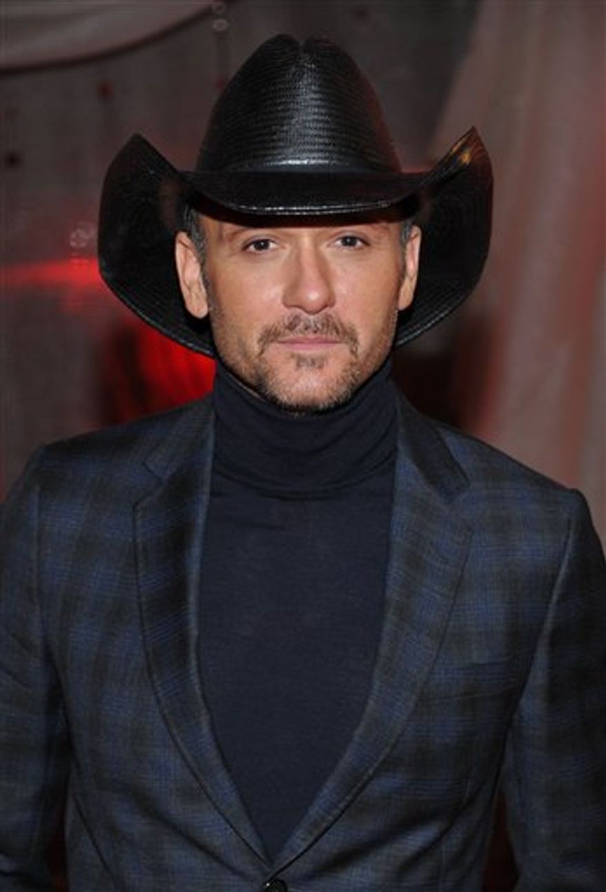 FILE - in a Nov. 9, 2010 file photo, recording artist Tim McGraw arrives at the 2010 BMI Country Awards in Nashville, Tenn. The satellite radio network SiriusXM said Monday, March 28, 2011 that it is celebrating 10 years of broadcasting country music with a Tim McGraw concert. McGraw will headline a special concert at the Beacon Theatre in New York on April 27. (AP Photo/Evan Agostini, File)